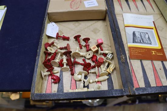 A Backgammon / chess board with stained ivory pieces